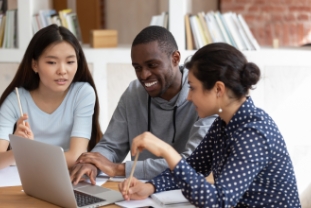 Smiling diverse students talk working